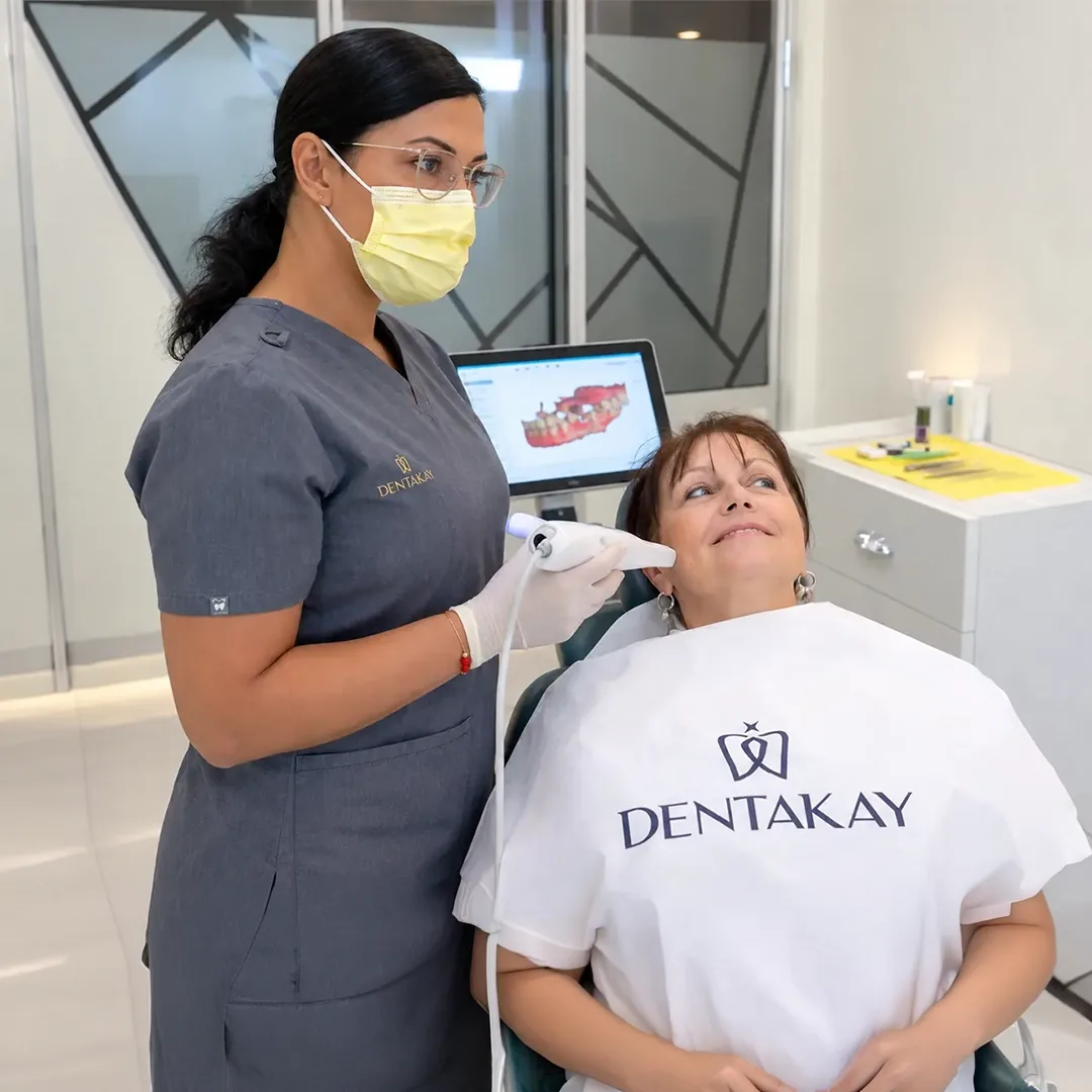 A Dentakay dental assistant taking a digital scan of a patient's teeth