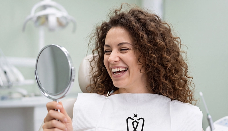 Dentist and patient reviewing a dental result at Dentakay